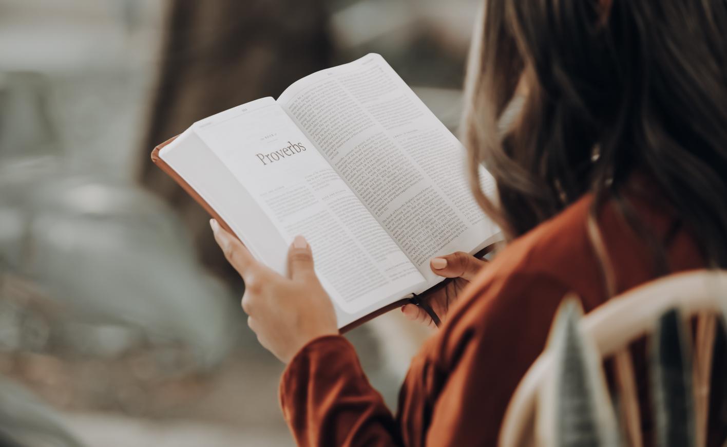 girl reading a bible