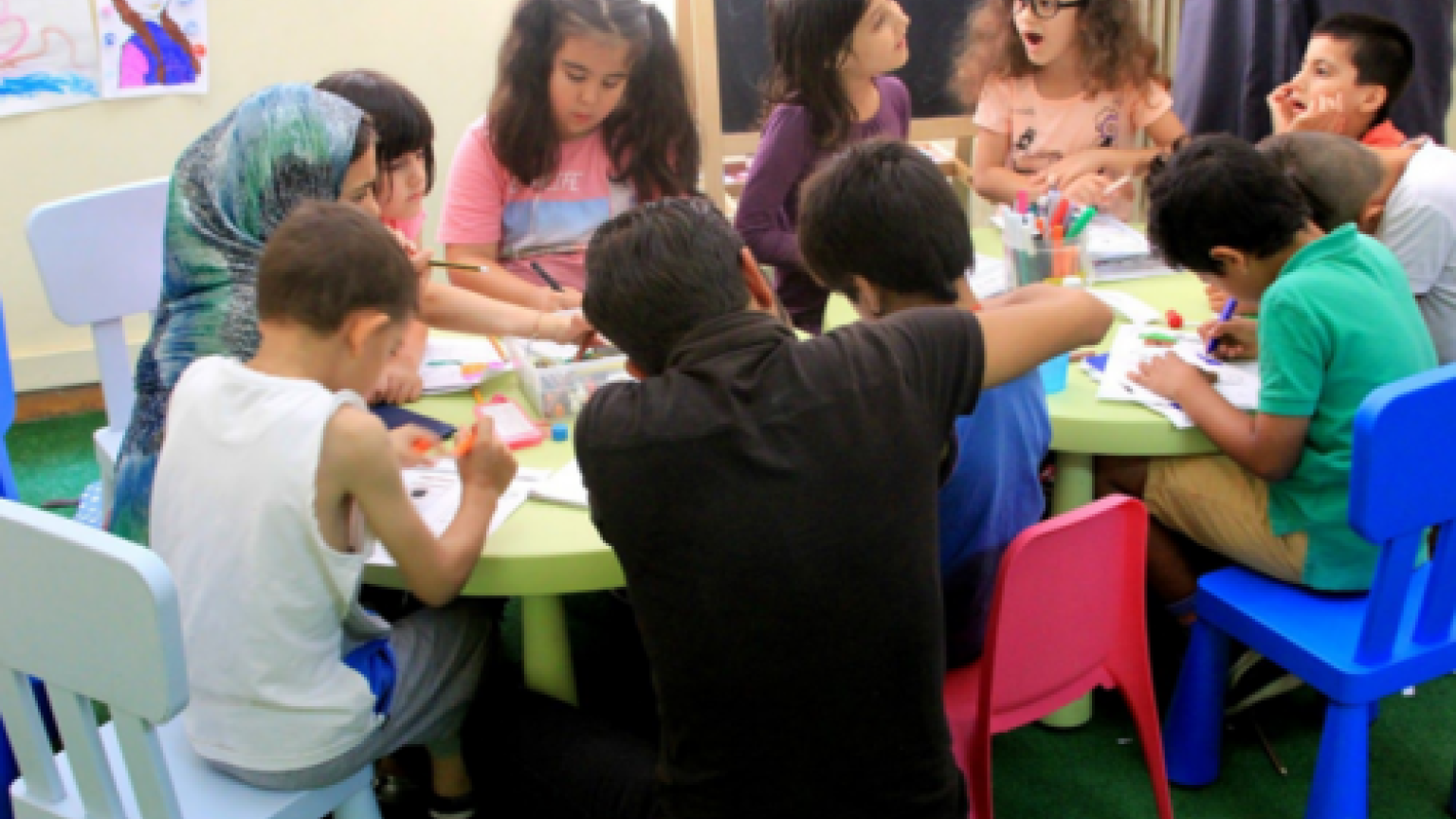 Children colouring together.