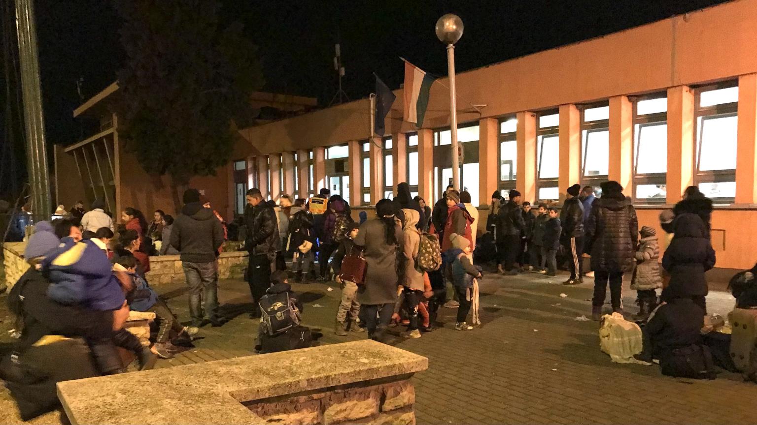 Ukrainian refugees gathered outside.