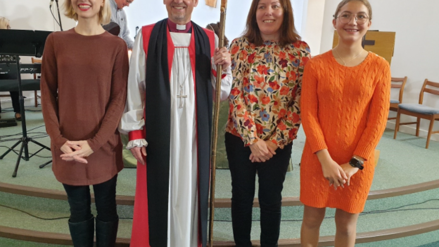 Bishop Robert with three female Christians.