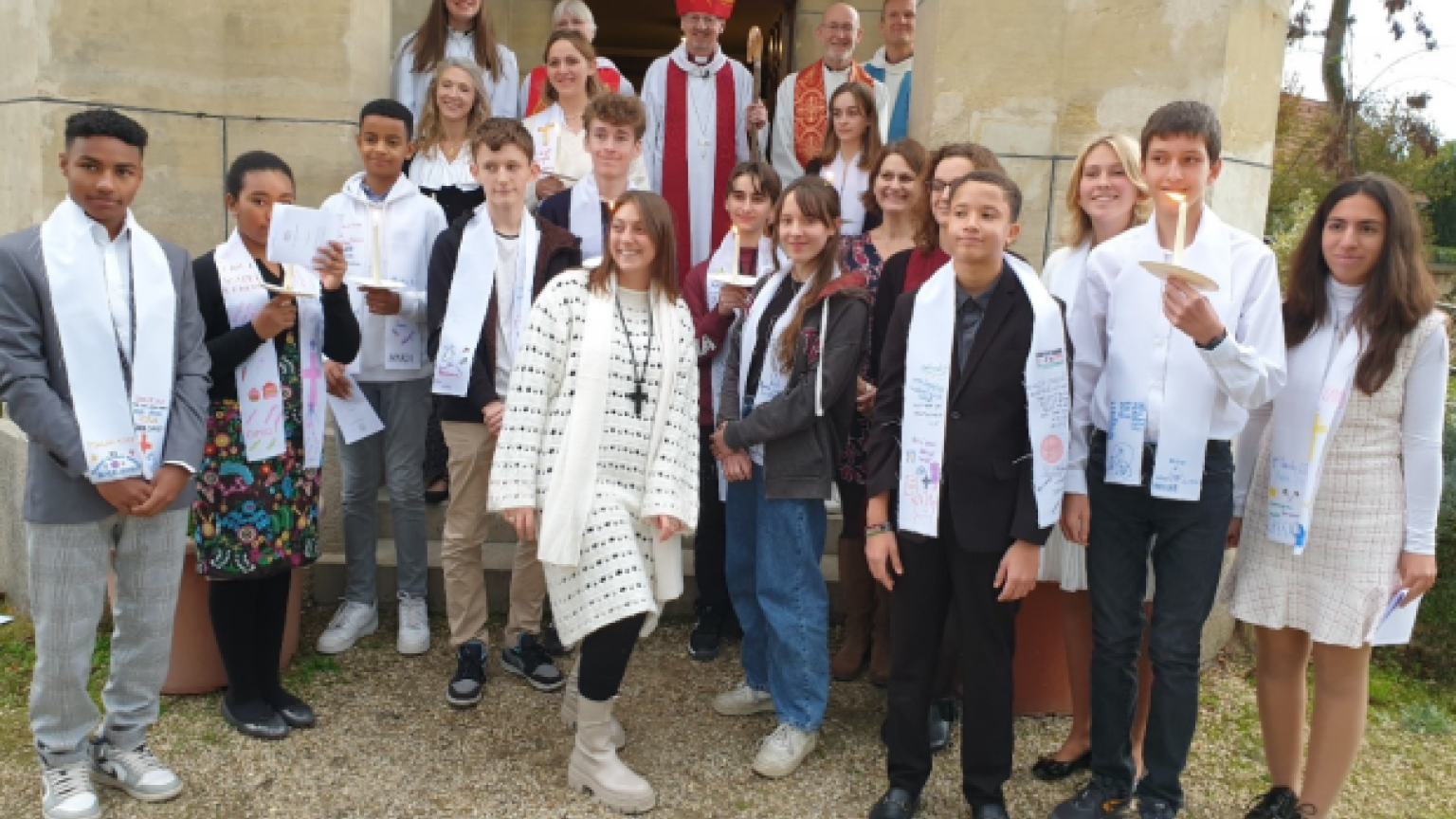 Bishop Robert and a group of young French Christians.