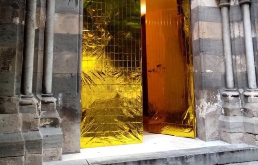 An ornate golden door.