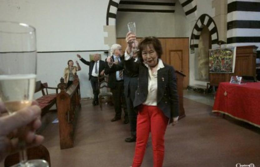 Someone raises a glass to King Charles.