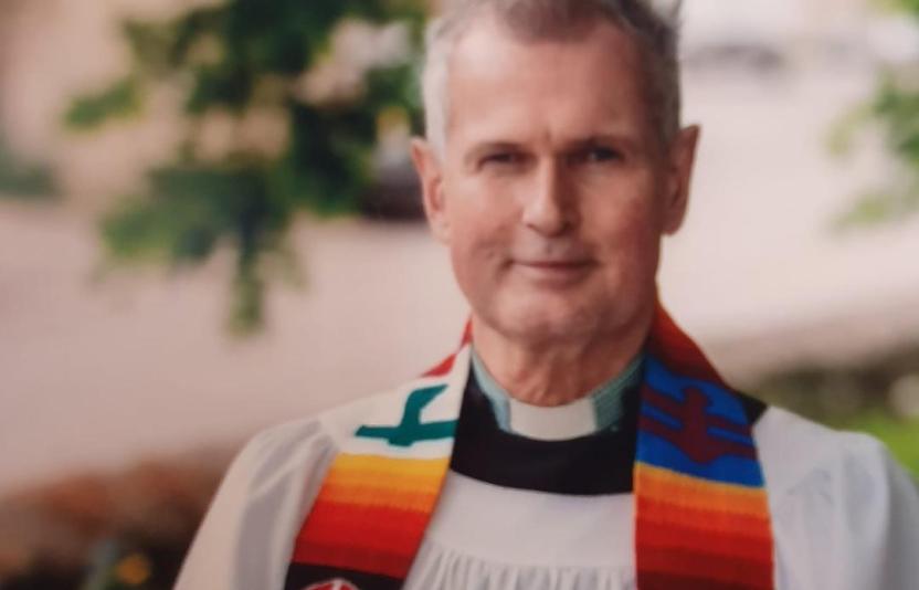 Head and shoulders of Donald McFadyen looking to camera in robes