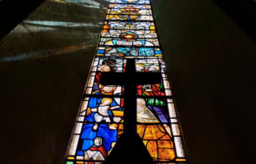 stained glass window and cross