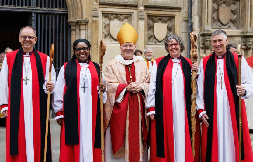 Bishop Andrew stands with three other new bishops 