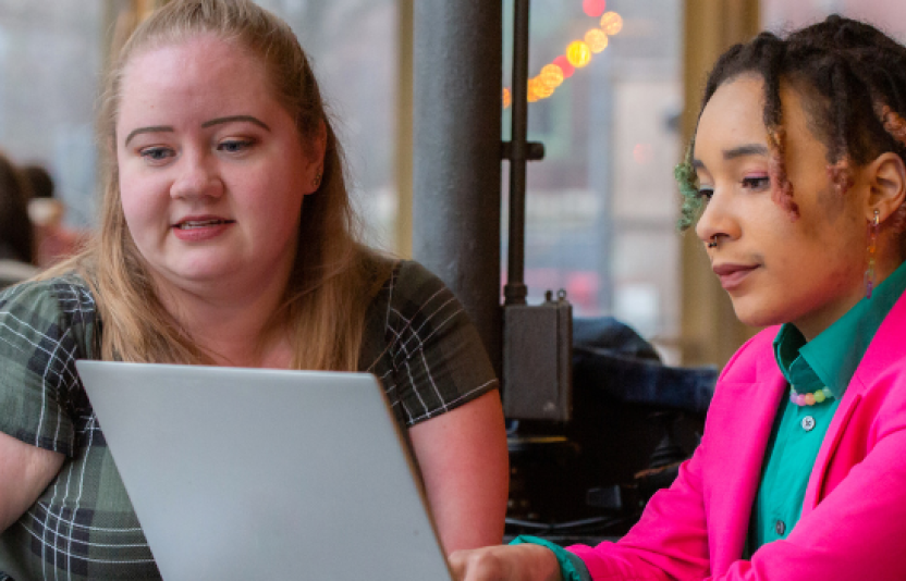two girls on a laptop
