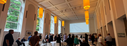 People sat at round tables for the Europe synod.