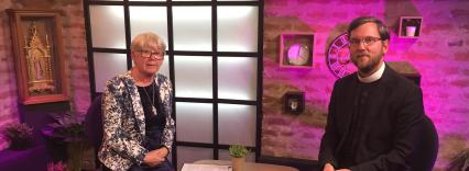 vicar in conversation with journalist