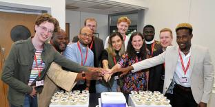 People around a cake