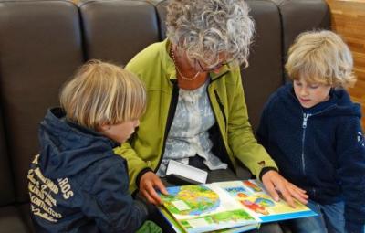 Children being read to from a book.