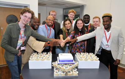 People around a cake