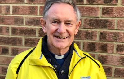 man in yellow jacket