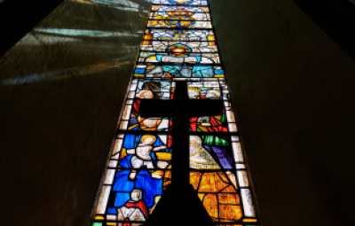 stained glass window and cross