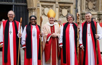 Bishop Andrew stands with three other new bishops 