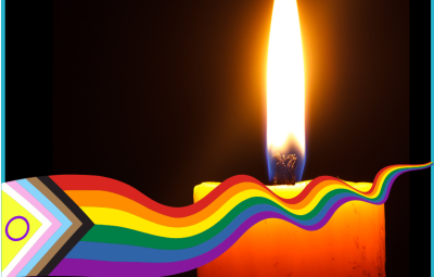 A lit candle behind an LGBTQIA+ ribbon