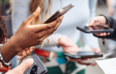 hands holding mobiles