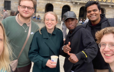 six young people smile to camera