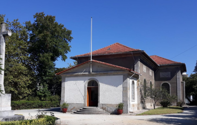 outside of a church against a blue sky