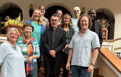 a group of people face the camera on stairs