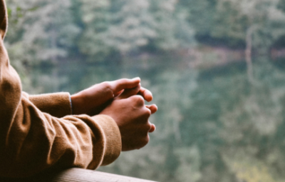 arms leaning with hands together