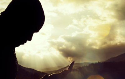 silhouette of a man praying against Sundays