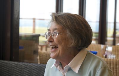 a lady laughs off camera