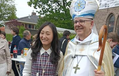 Bishop and confirmand outside church