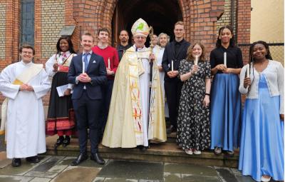 Row of clergy and laity outside a church in Norway