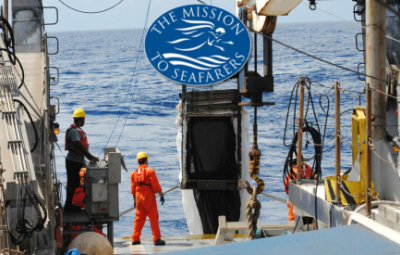sailors on a ship with logo