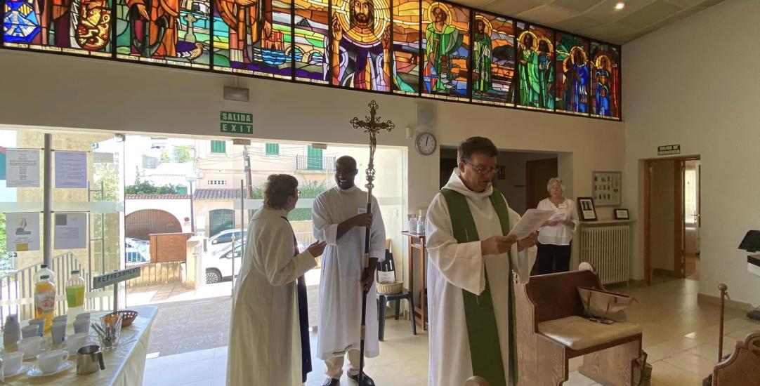 vicar reading a notice