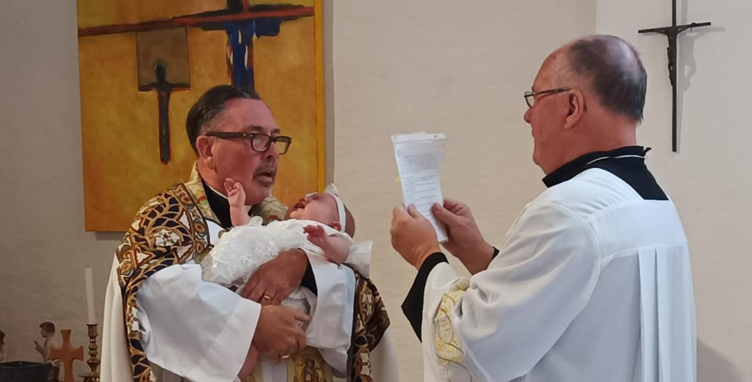 a baby being baptised 