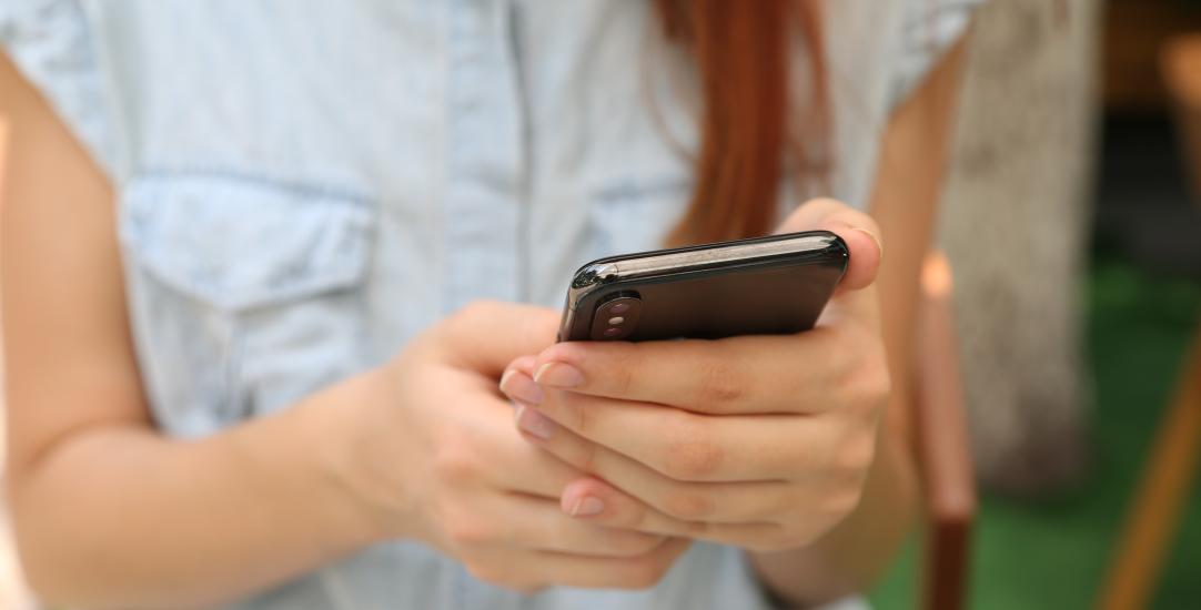 woman on looking at phone