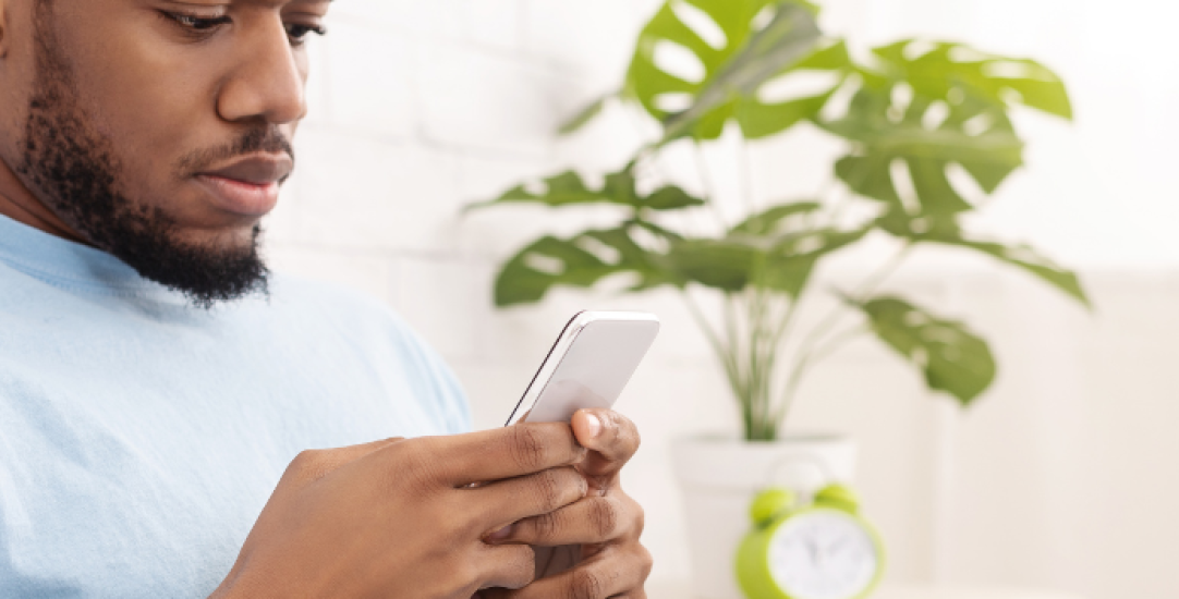 man looking at phone
